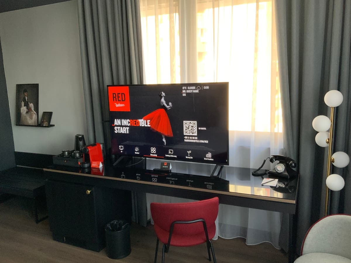 Hotel television displaying Smartell IPTV solution with service menu